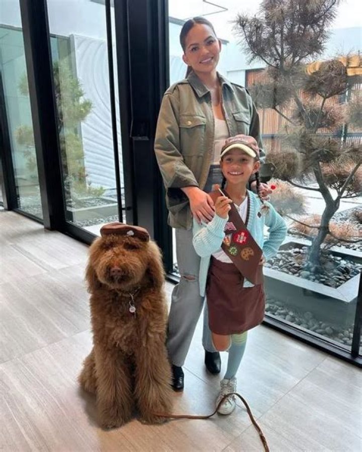 Chrissy Teigen’s Daughter Luna Makes Their Rescue Poodle Petey an Honorary Girl Scout
