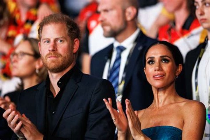 Prince Harry and Meghan seen 'cozying' up with Hollywood billionaire